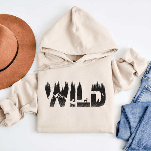 Step into the wild with our unique camping hoodie, featuring a captivating camping scene intricately etched inside the words "Into The Wild". Crafted for outdoor enthusiasts, this hoodie is not just a piece of clothing but a symbol of adventure and exploration.